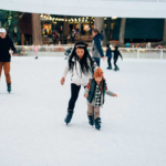 Family ice skating at SkyPark at Santa's Village