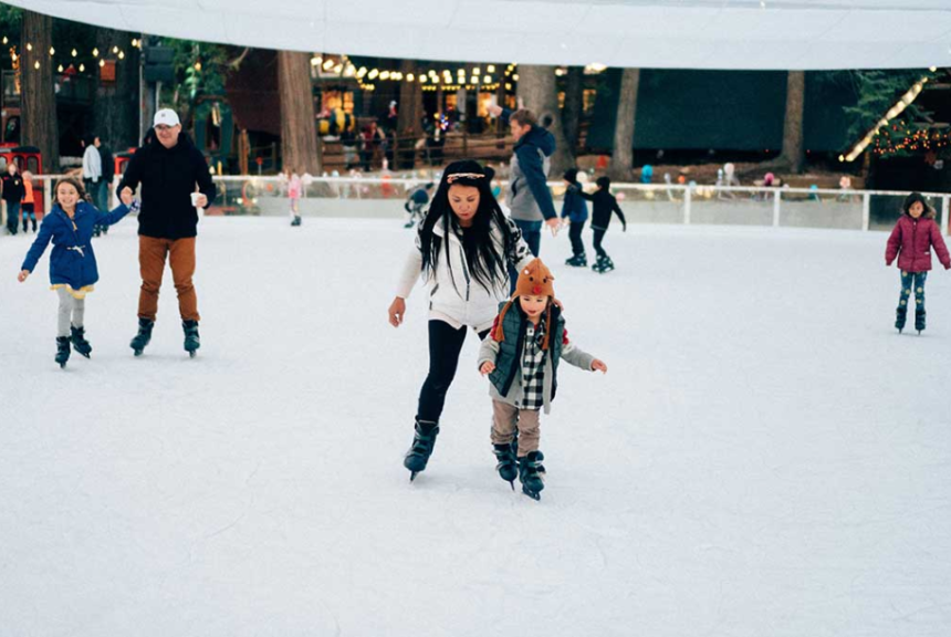 Family ice skating at SkyPark at Santa's Village